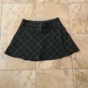 BEBE Black Grid Mini Skirt
(Size 8)